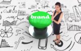 word-brand-thoughtful-businesswoman-against-digitally-generated-green-push-button_1134-53839